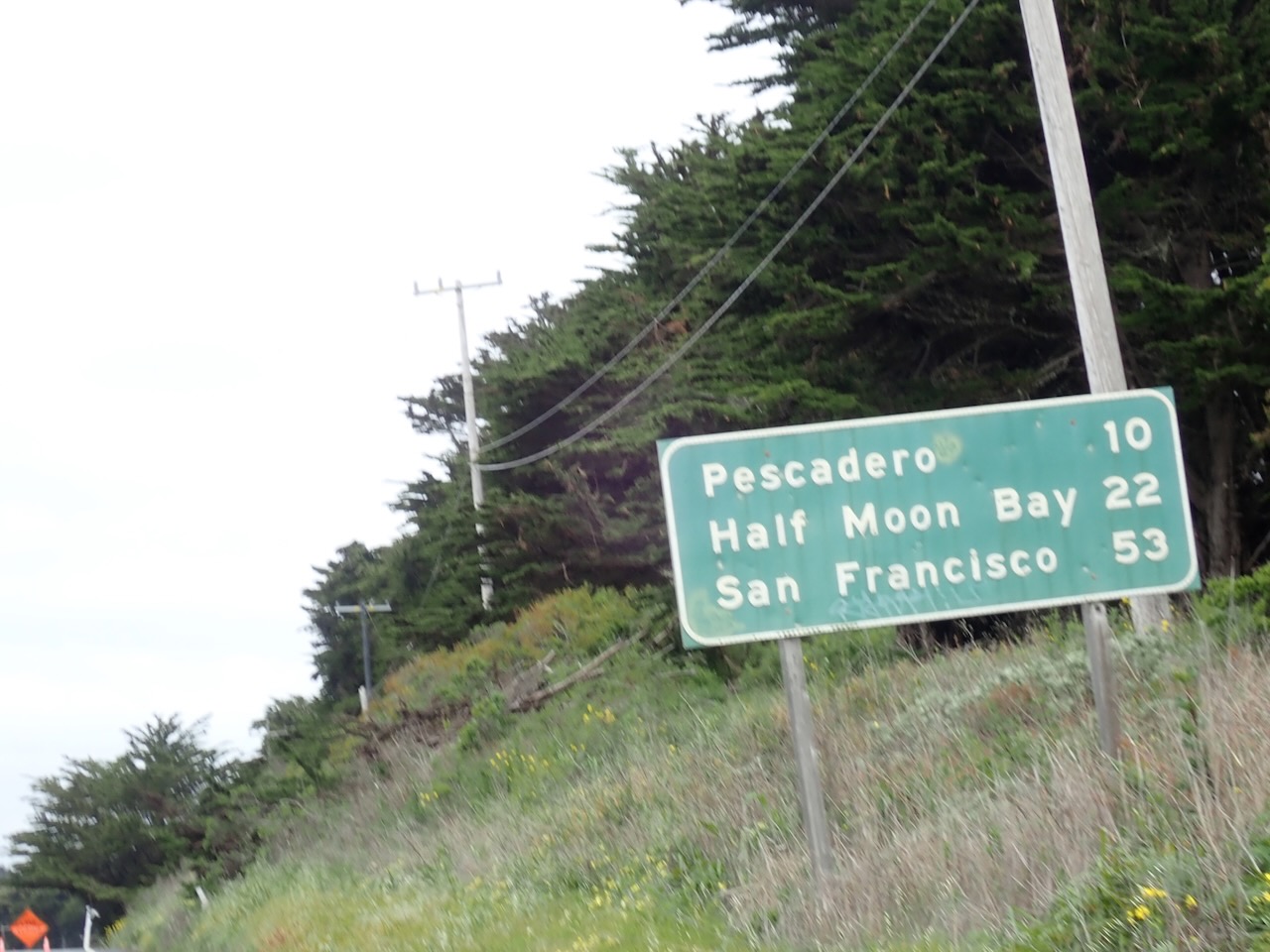 Road sign. 10 miles to pescadero, 22 miles to half moon ba, 53 miles to san francisco